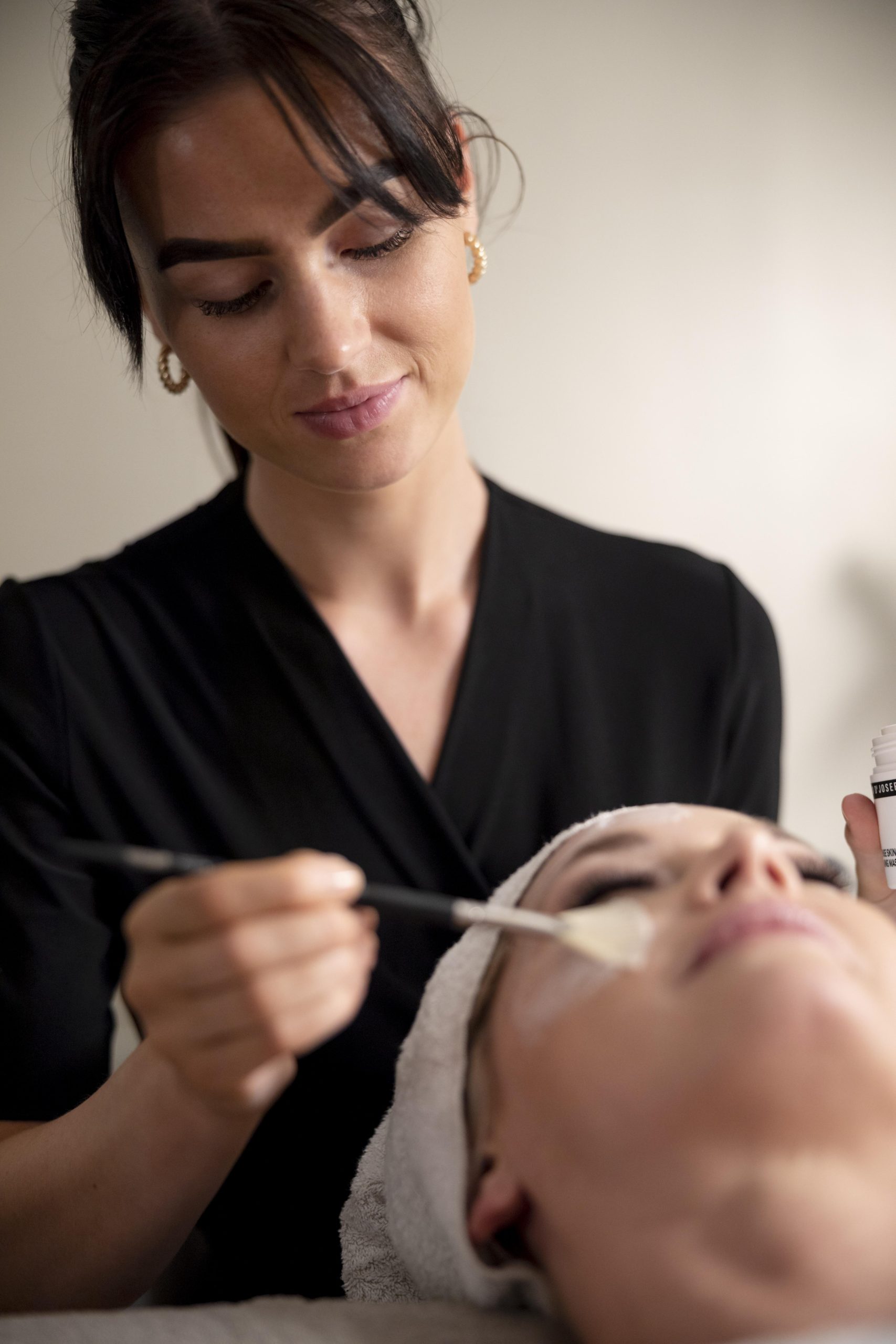 young-woman-using-face-treatment-her-client